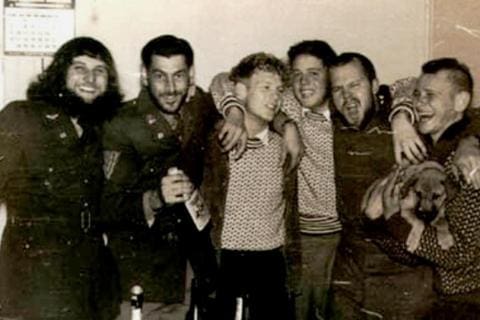 MARION 18 (April 1961-March 1962): (L-R) George Norval (Radio Technician), Lou "Loutjie" de Beer (Medic), Bernie Booyens (Meteorologist), Christo "Wolfie" Wolfaardt (Meteorologist), Toby Mynhardt (Radio Operator), Chris G. Snyman holding Oubaas (Meteorologist/Physicist); Absent: Pieter A. "Piet" le Roux (Leader/Senior Meteorologist).