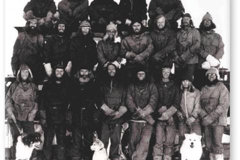 SANAE 16  (1975): Back (L-R) Gert Meyer, Ken Cleland, Rob Heard, Sandor Rozsnyai, John Rash; Middle: Wolfgang Deckler, Stephan Bothma, Mike Perks, Tino Rupping, Donald King, Desmond Duthie, Gert Ochse, Carel Brand; Front: Padraig Culligan, Graham Meineke, Godfrey Knight, Evan Morkel (Leader), Richard Otto, Gerhard Barnardo, Heinz Kramer, Stewart Lund; Dogs: Ringo, Frosty, Kerneels.