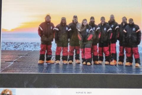 SANAE 52 (2013): (L-R) Wihann Groenewald (Diesel Mechanic), Karabo Mokwena (Senior Meteorologist), Craig Harrison (Mechanical Engineer), Grethe Rademan (Cosmic Ray Engineer), Philip Mey (HF Radar Engineer), Rob Coetzee (Doctor & Deputy Team Leader), Adam Zieba (Electronic Engineer & Team Leader), Pieter du Plooy (Diesel Mechanic), Kgomotso Puleng (Electrical Engineer); (Insert) Cornelia Oberholzer (Space Weather Engineer) sustained an injury during the 2013 take-over.